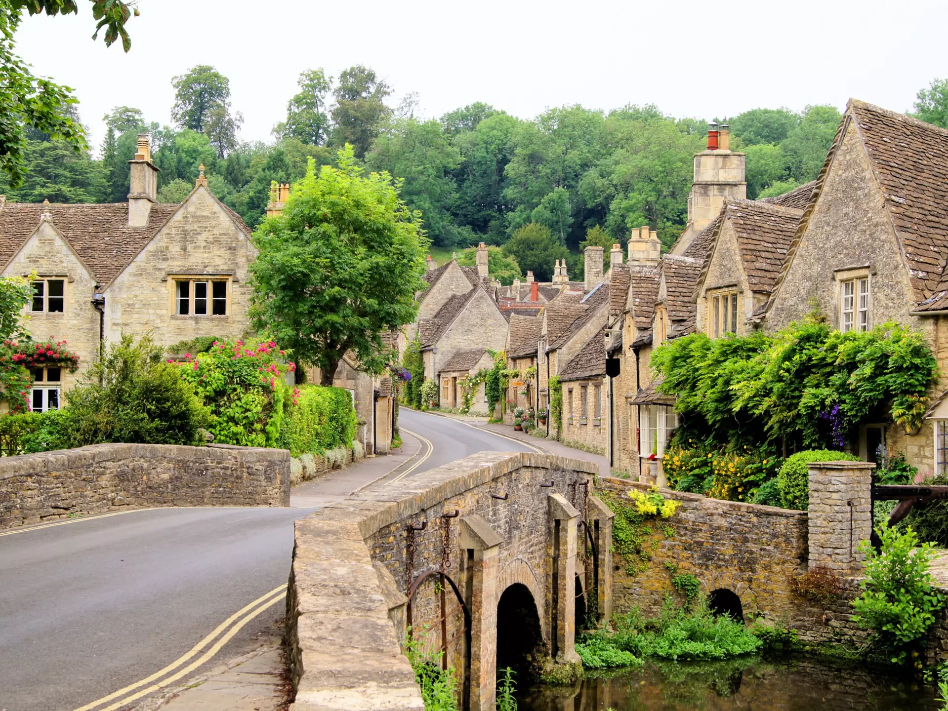 A traditional village, with a narrow street lined with stone cottages