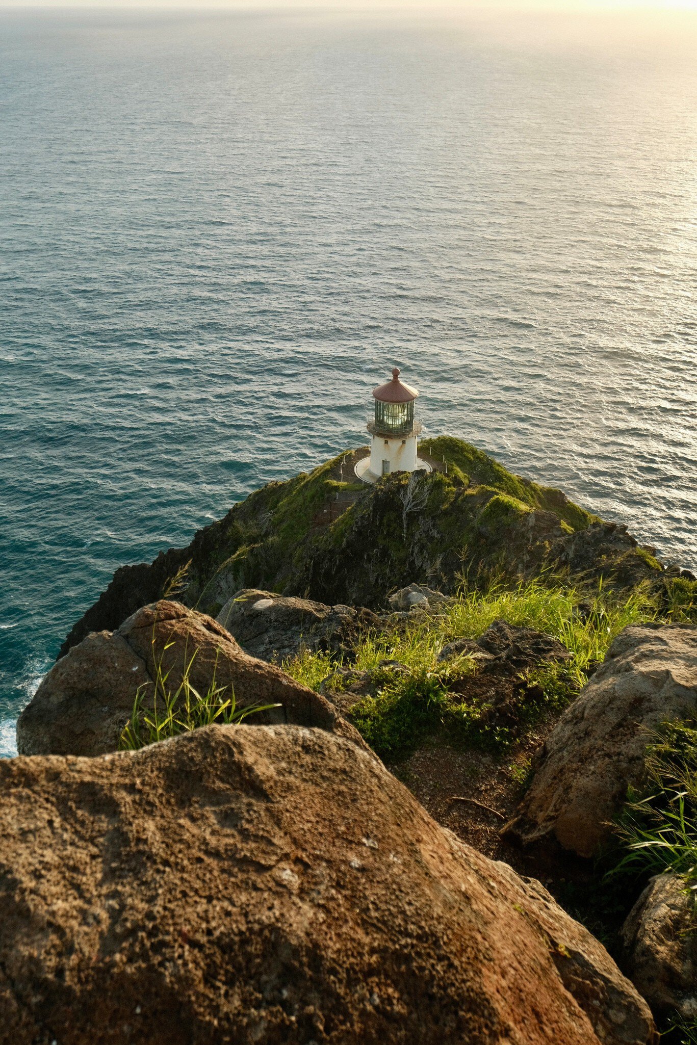 A lighthouse on a rocky outcrop.