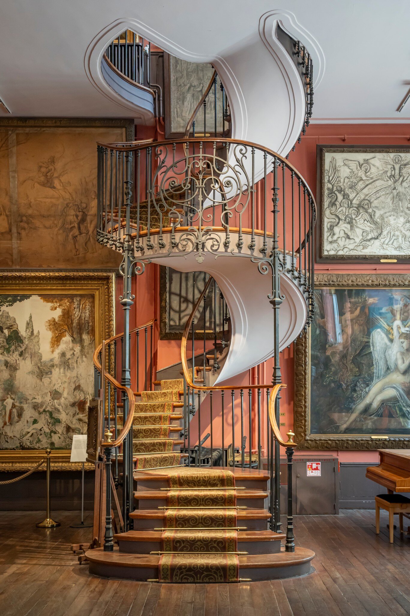 Paris, France - 06 08 2025: Gustave Moreau Museum. Detail view of the Artist's studio with its majestic spiral staircase, bay windows, paintings hanging on the walls and a wooden parquet floor , License Type: media, Download Time: 2025-08-04T18:59:27.000Z, User: rhylton_redventures, Editorial: true, purchase_order: 65050 - Digital Destinations and Articles, job: Lonely Planet, client: wip, other: app downloads