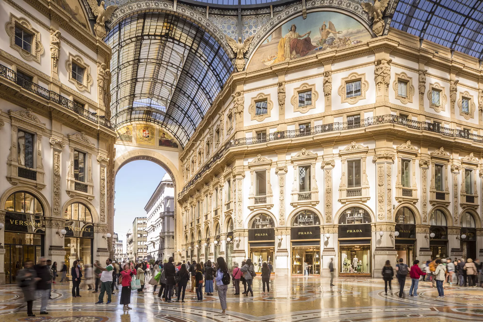 The interior of the Galleria Vittorio Emanuele II in Milan with the original Prada store in the background