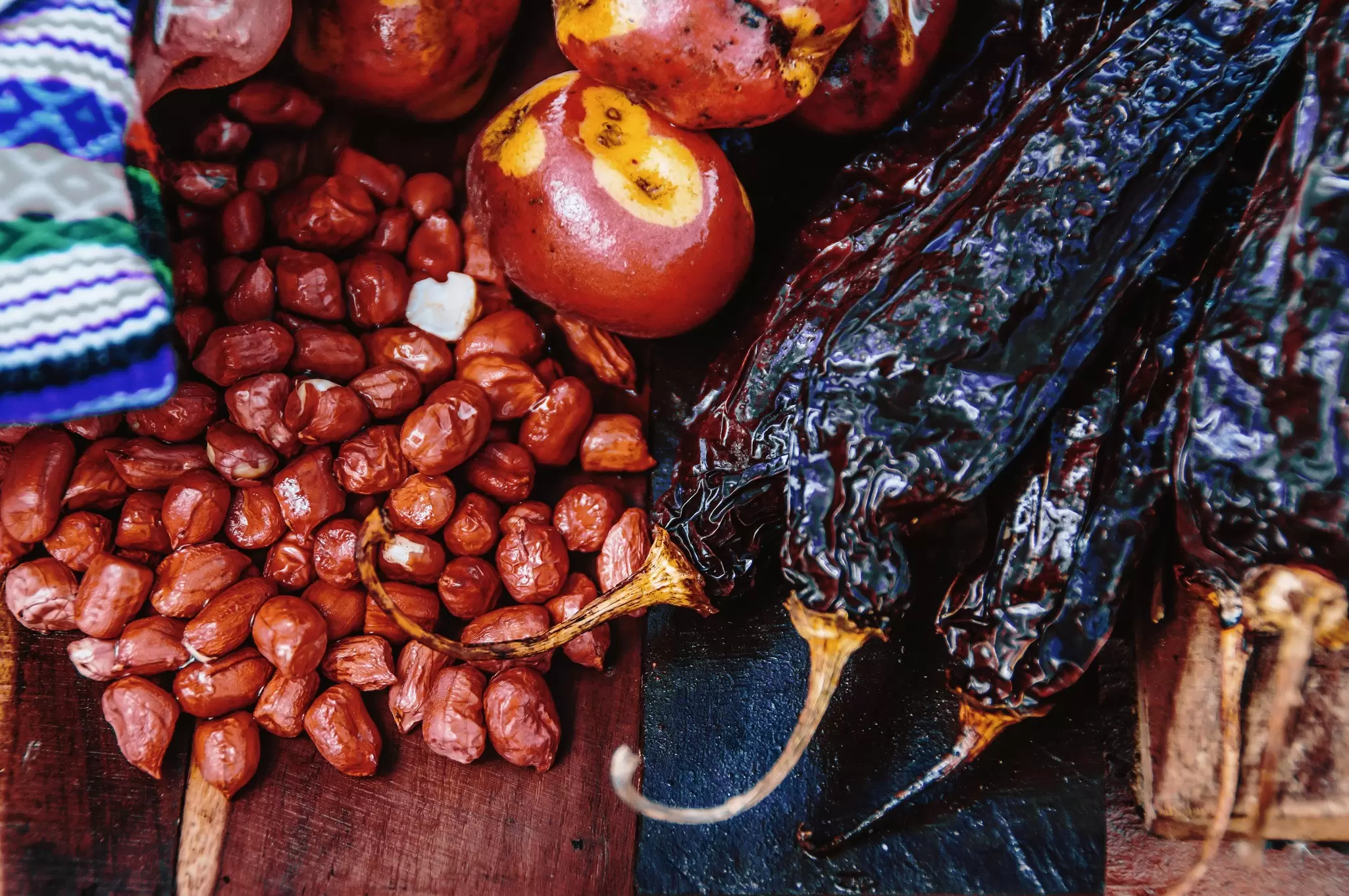 Much of Peru's cooking begins and ends with the humble potato, but other staple ingredients include chilis, corn and quinoa. Gustavo Ramirez / Getty Images