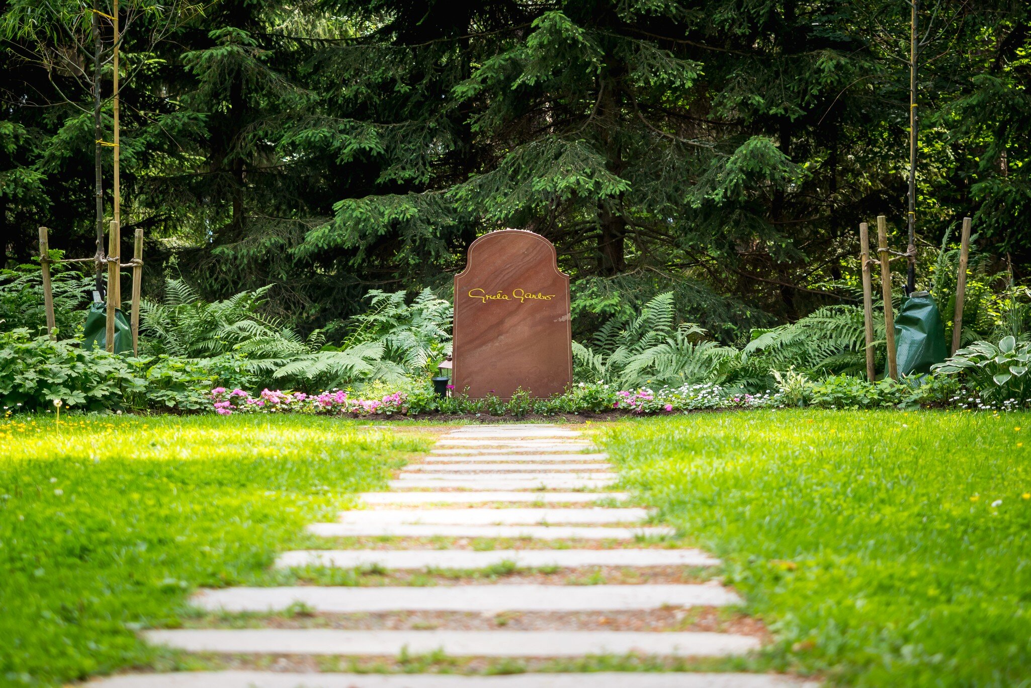 Stockholm, Sweden - June 30, 2016: Greta Garbo's gravestone at Skogskyrkogården, Stockholm, Sweden. The Swedish-born Hollywood actress died in New York City in 1990. Her ashes were interred at  Skogskyrkogården Cemetery in 1990.