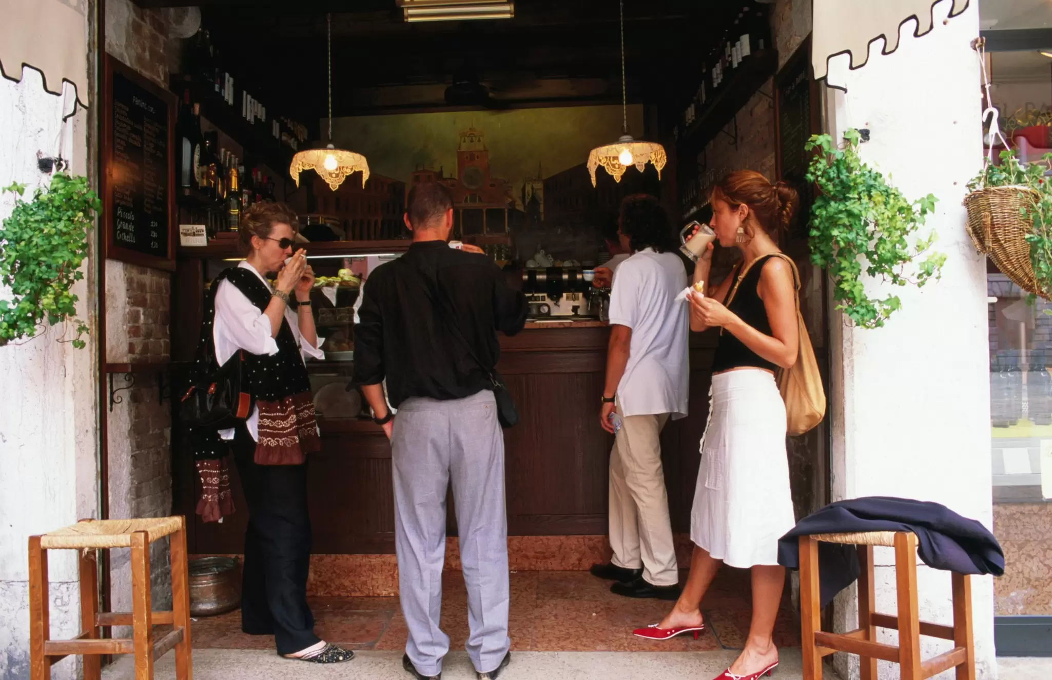 Locals having a standing coffee at Al Marca cafe in Venice, Italy
