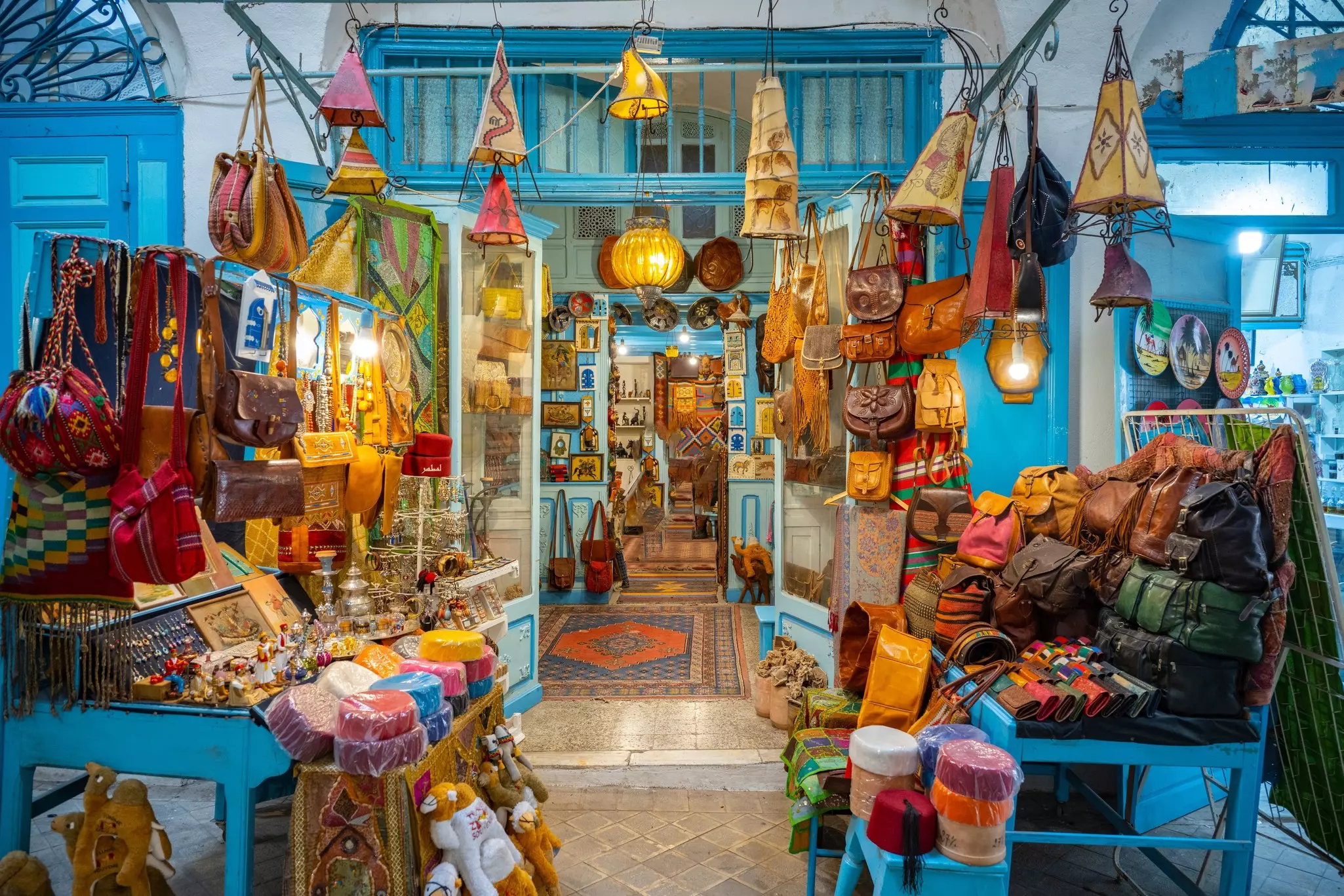 Souvenir earthenware and carpets in market in Sidi Bou Said, Tunis, Tunisia