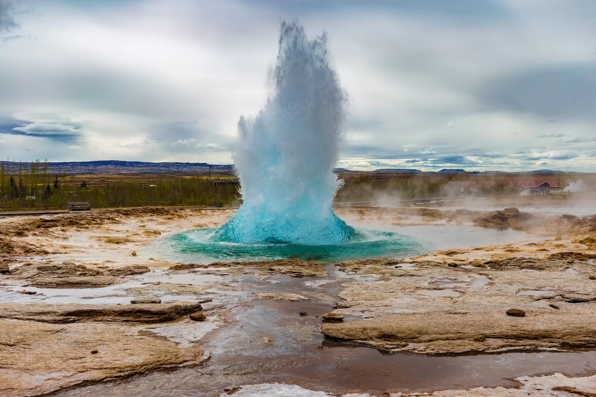 View of the Great Geysir erupting in spring in Iceland.