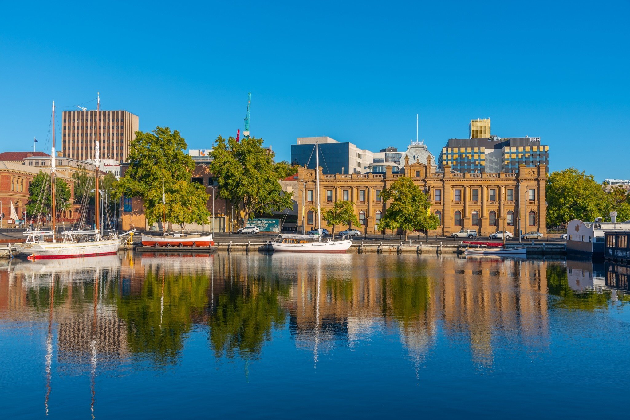 Tasmanian Museum and Art Gallery with reflection on waterfront in Hobart, Australia.
