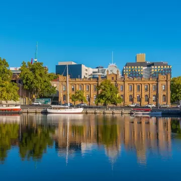 Tasmanian Museum and Art Gallery with reflection on waterfront in Hobart, Australia.