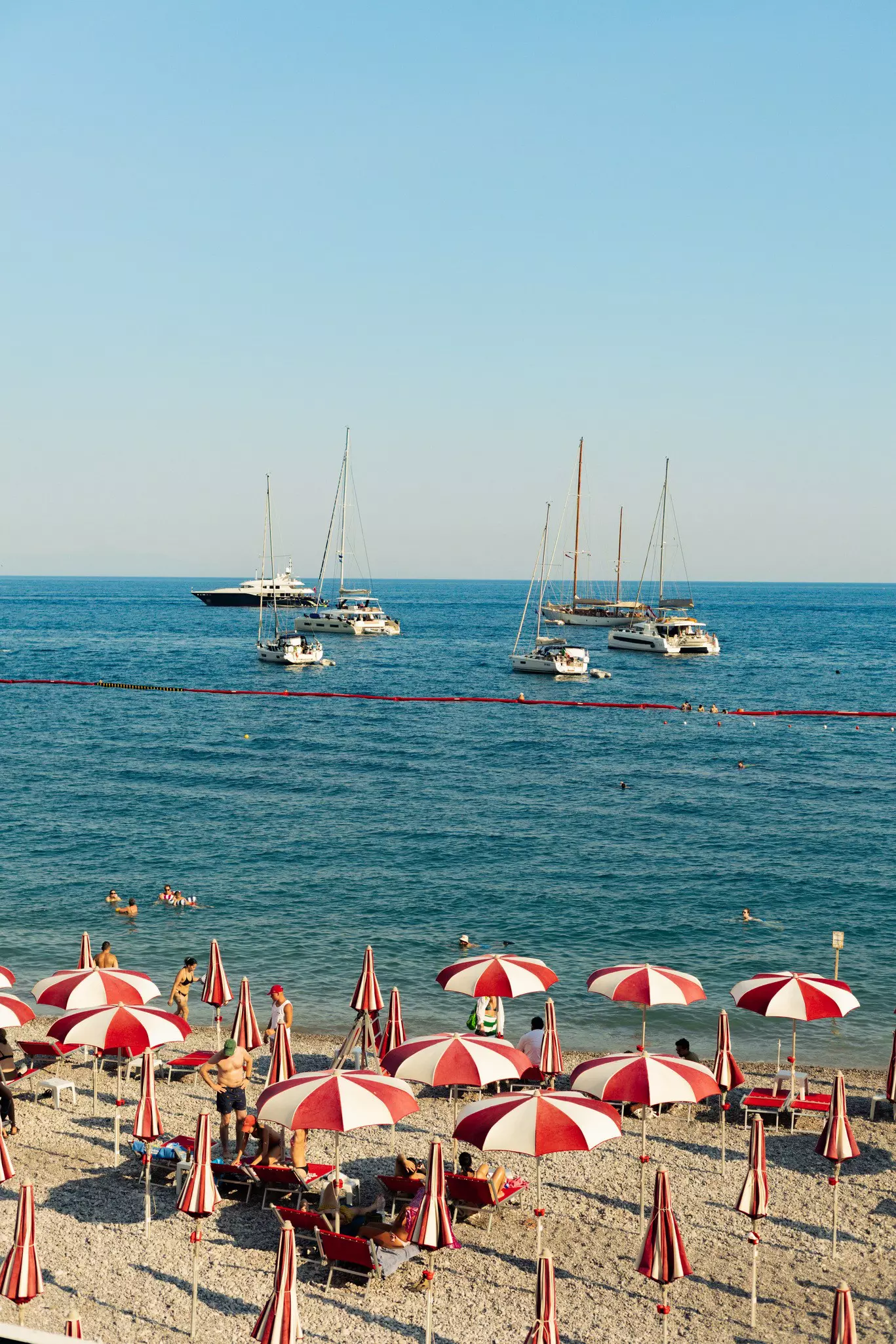 red and white striped beach umbrellas at Marina Grande Amalfi, Italy.