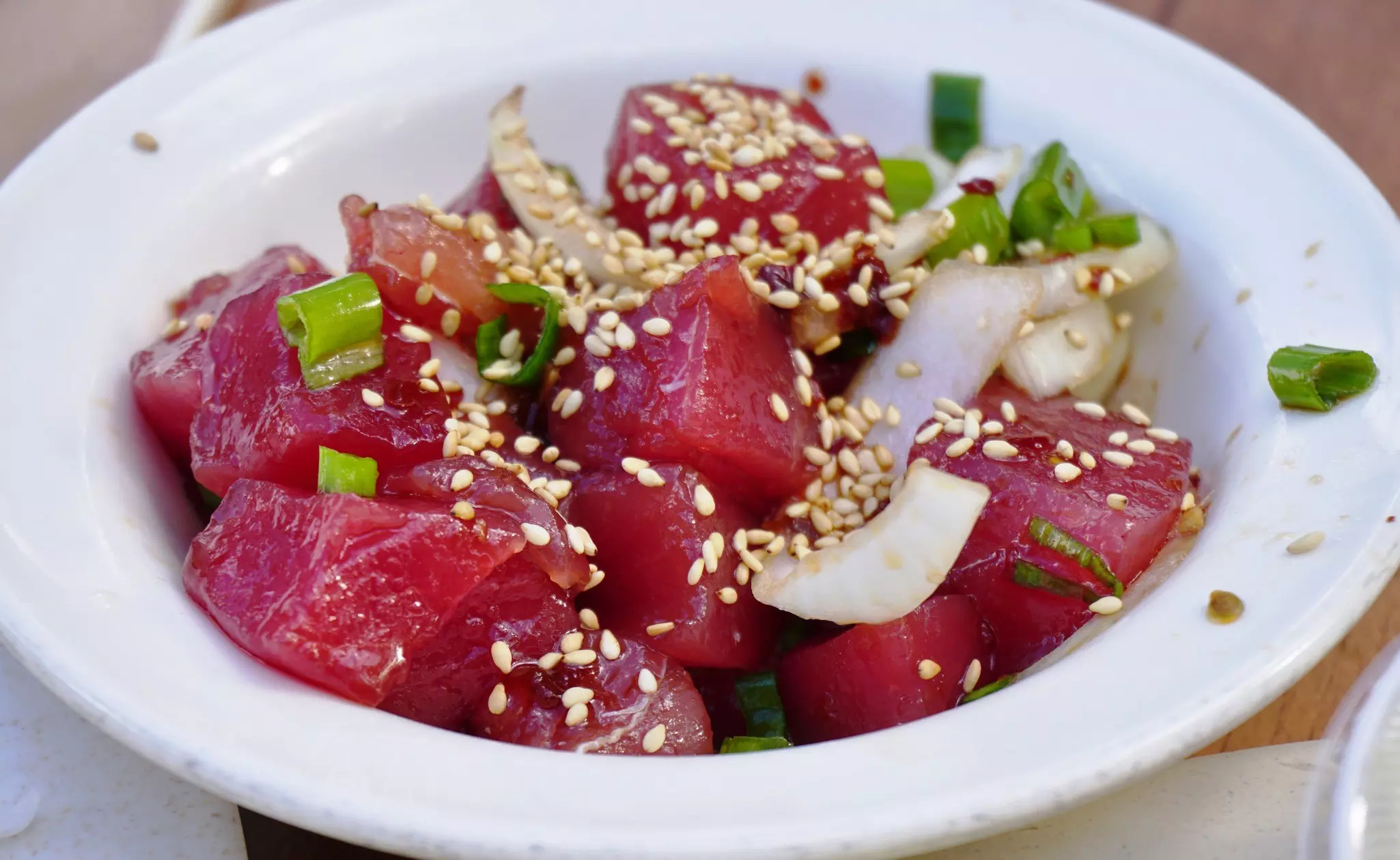 Hawaiian poke with onions and sesame seeds.