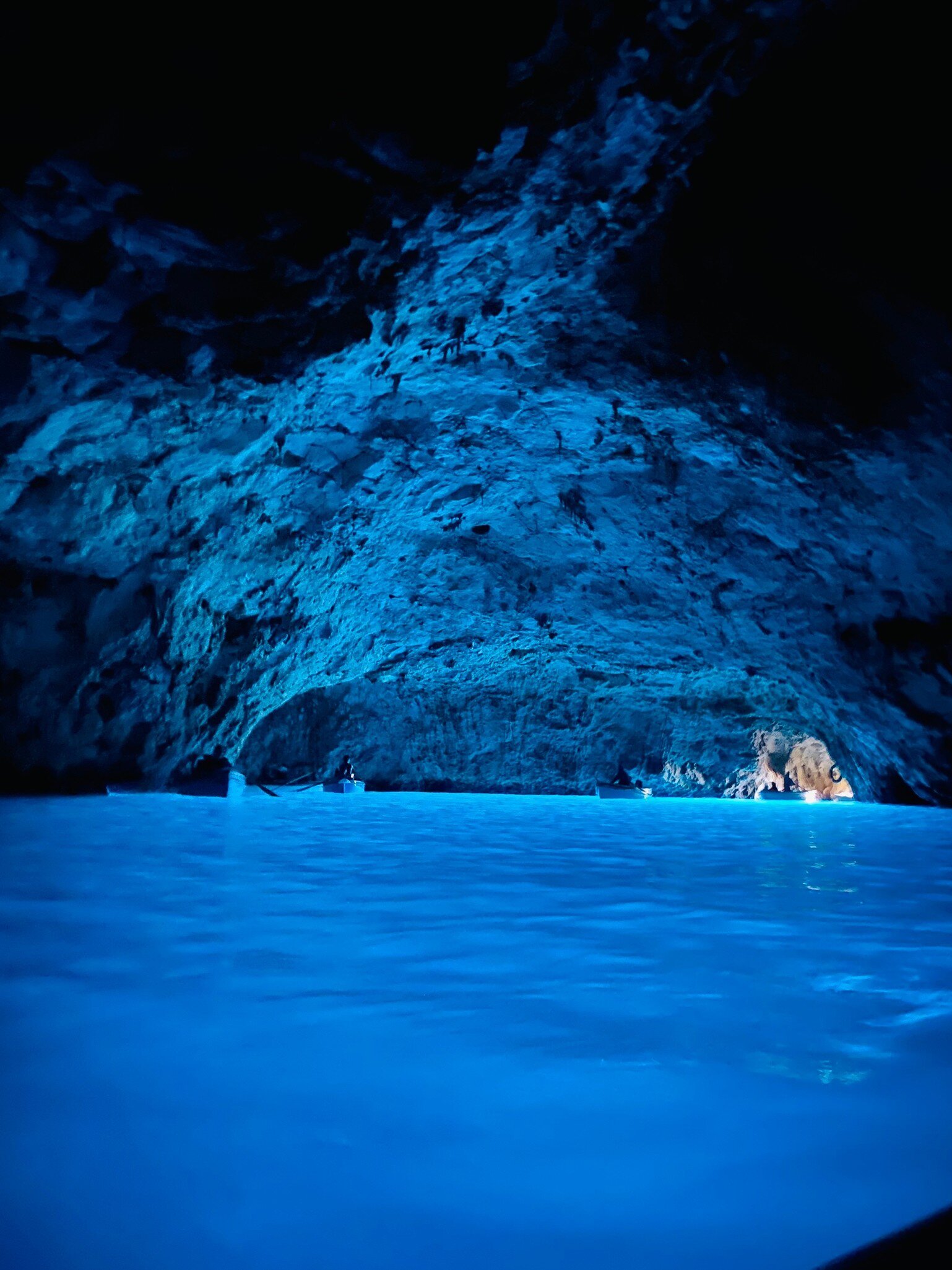 Interior of the Grotta Azzurra illuminated by blue light in Capri, Italy.