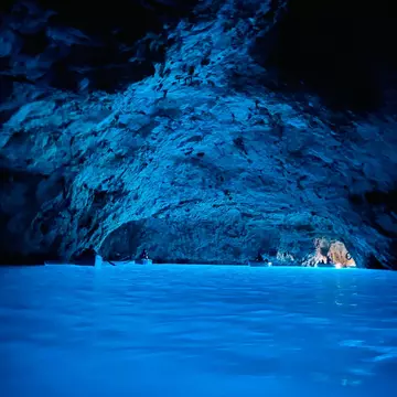 Interior of the Grotta Azzurra illuminated by blue light in Capri, Italy.