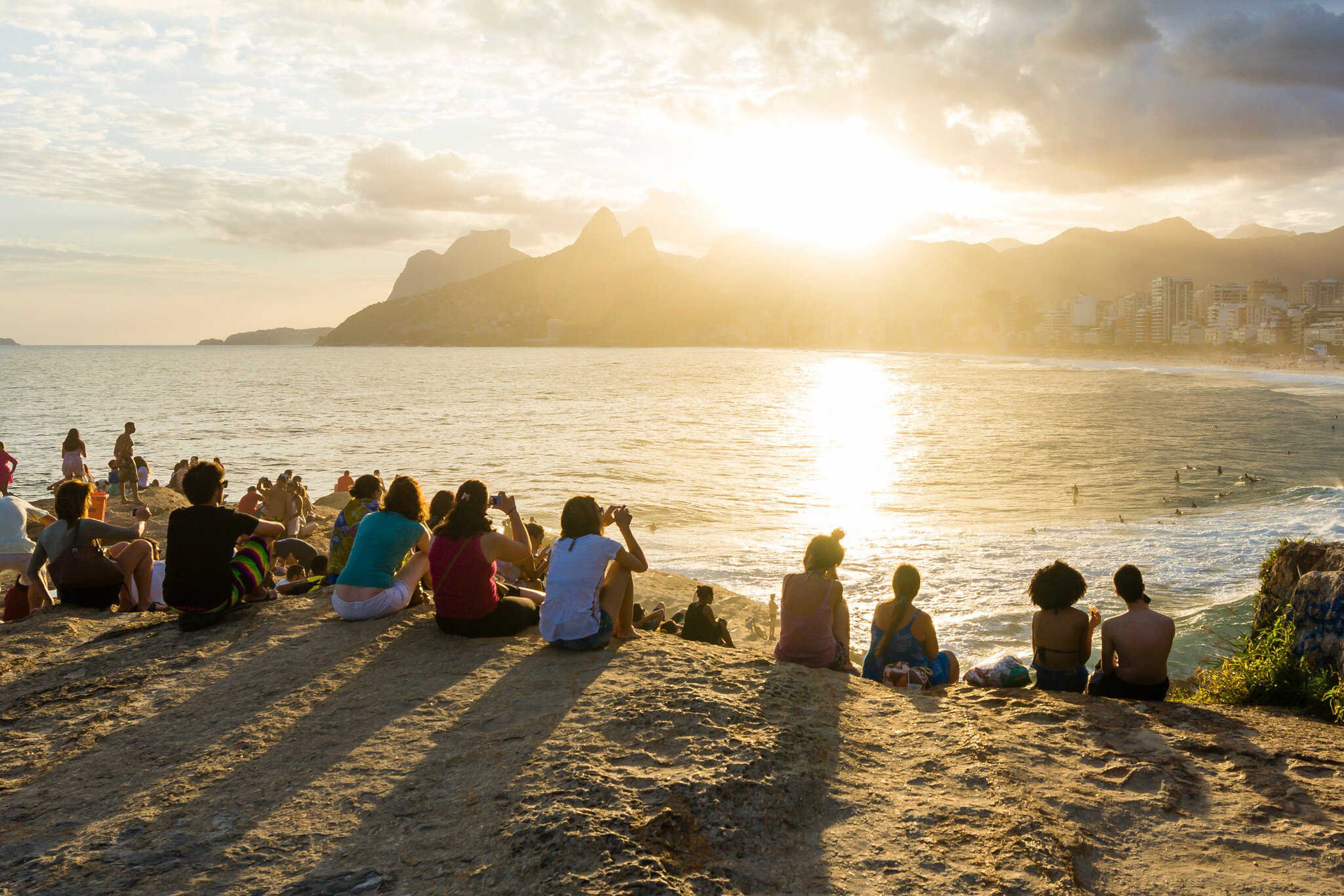 RIO DE JANEIRO, BRAZIL - APRIL 5 2015: Crowds gather on the rocks of Pedra do Arpoador in Rio de Janeiro to watch a spectacular sunset., License Type: media, Download Time: 2025-05-22T13:30:23.000Z, User: lonelyplanetmedia, Editorial: true, purchase_order: 65050 - Digital Destinations and Articles, job: Global Publishing WIP, client: Global Publishing WIP, other: Pia Peterson Haggarty // SS Comp Ingestion