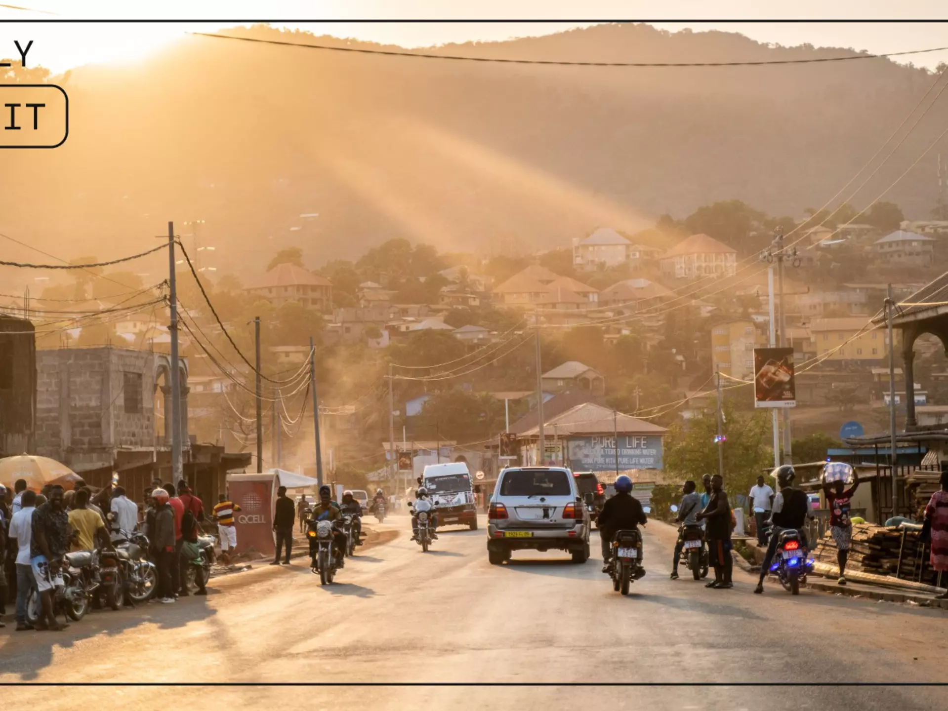 After a full day of driving and one border crossing, the lead car in Juan’s group enters the city of Freetown at sunset © Juan Martinez / Lonely Planet