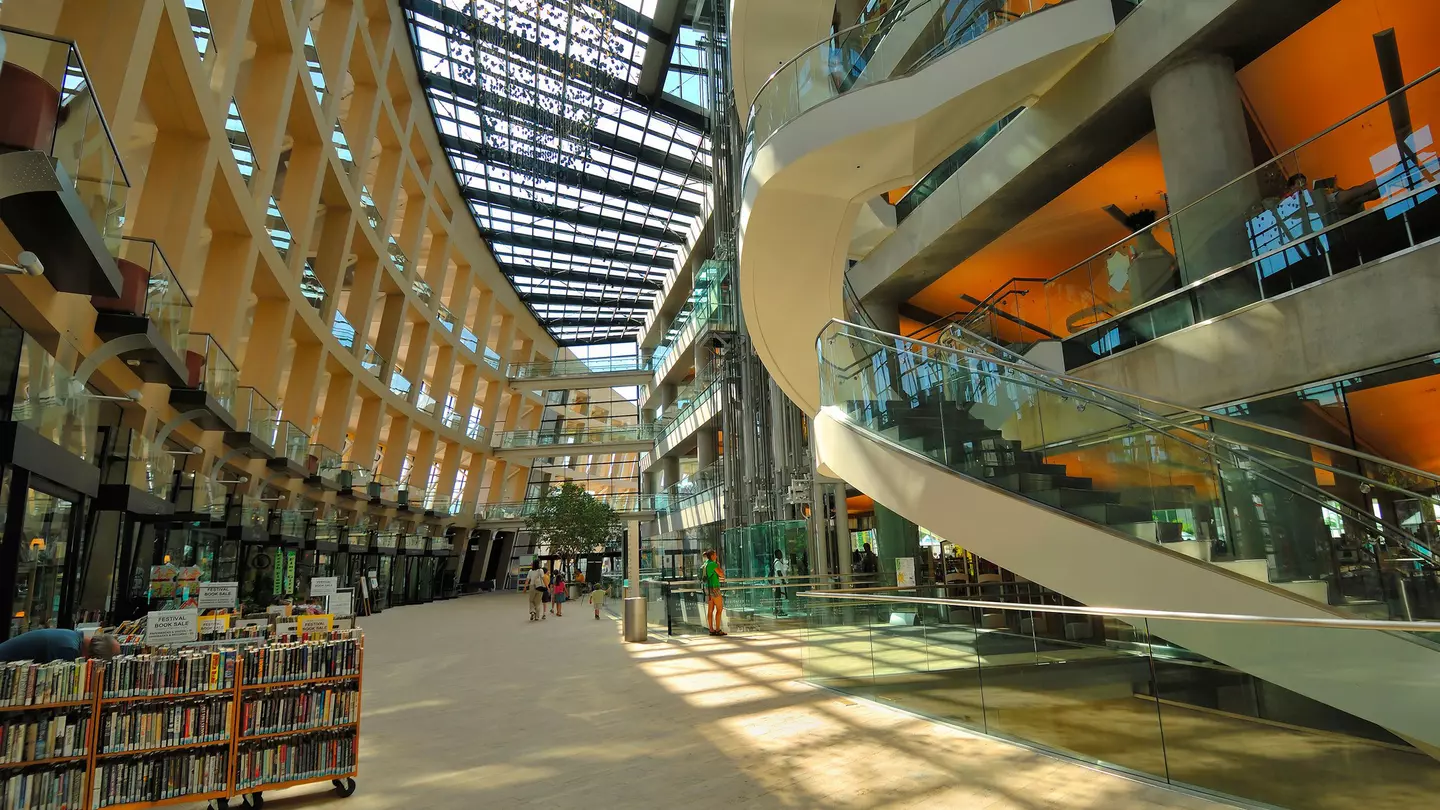 The modern atrium with stairwells, hallways and racks of books at Salt Lake City Public Library