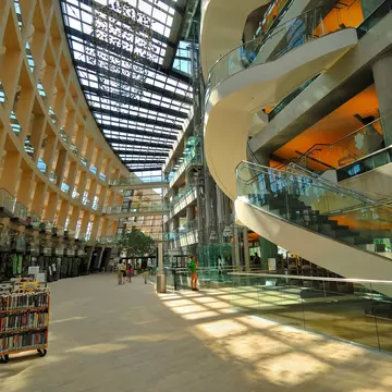 The modern atrium with stairwells, hallways and racks of books at Salt Lake City Public Library