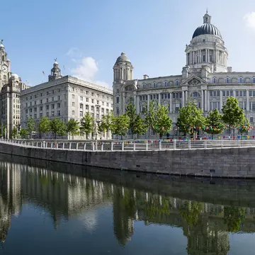 The buildings known as the Three Graces are among Liverpool's world class architecture. SimonD02 / Getty Images