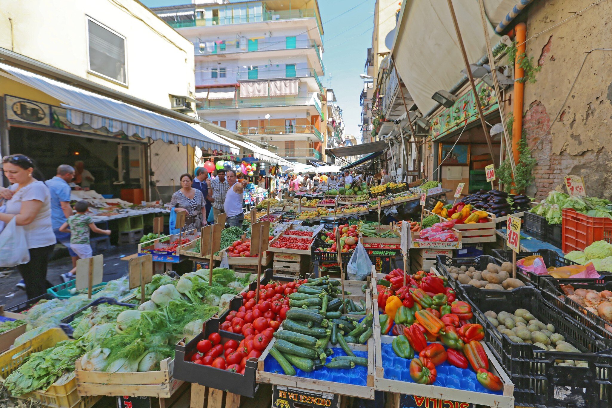 Naples, Italy - June 22, 2014: Local People Shopping at Sunday Street Market Porta Nolana in Napoli, Italy.