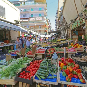 Naples, Italy - June 22, 2014: Local People Shopping at Sunday Street Market Porta Nolana in Napoli, Italy.