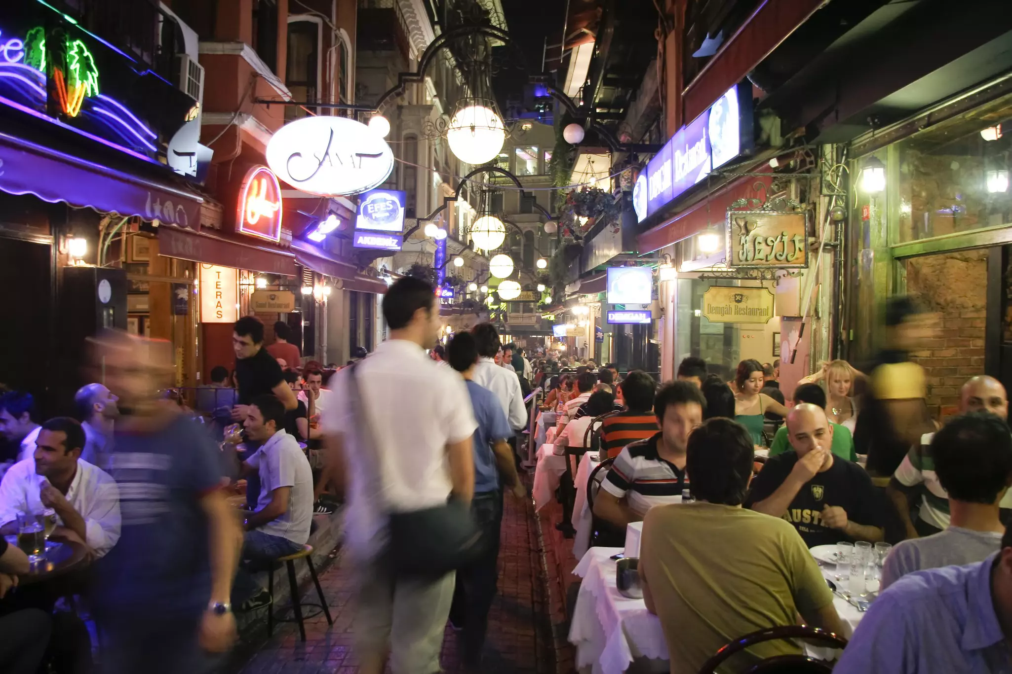 Busy restaurant and bar scene at night in Taksim, Istanbul, Turkey on July 25, 2007. Taksim is a popular destination for tourists and locals of Istanbul. 26882794 bar, barcelona, beer, busy, capital, city, citylife, crowd, cuisine, customers, eat,...