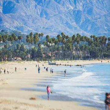 Beautiful view of Santa Barbara ocean front walk, with beach and marina, palms and mountains, Santa Ynez mountains and Pacific Ocean, Santa Barbara  county, California, United States, summer sunny day
