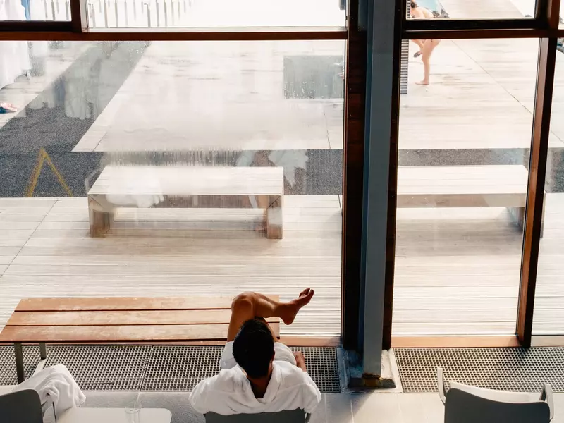 Person sitting in the interior of the Blue Lagoon common area