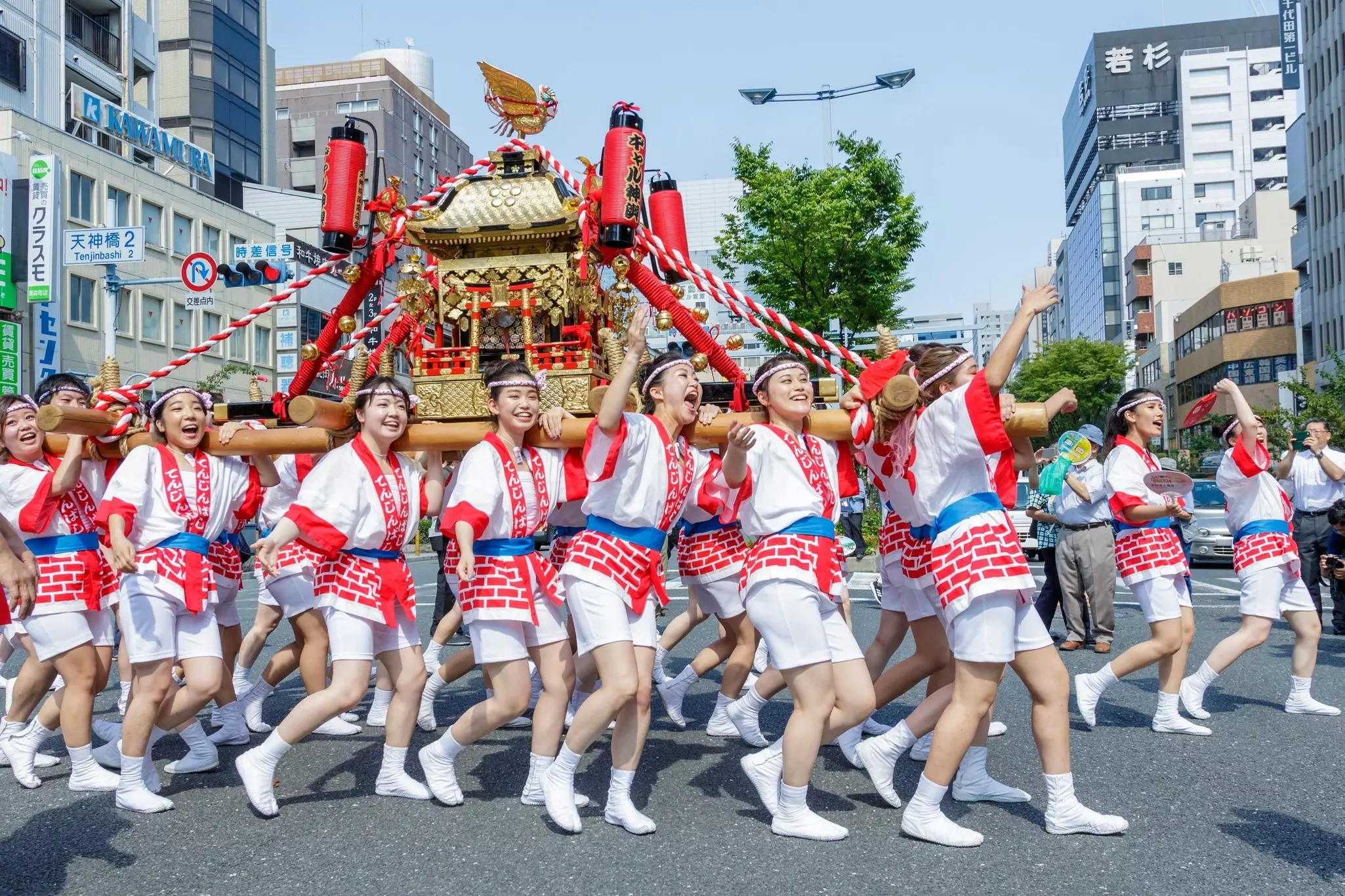 Women carrying a shrine at the Tenjin Festival in Osaka. 
