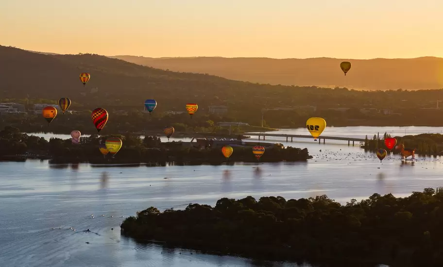 Aerial view from a Hot Air Balloon at sunrise of Lake Burley Griffin and Black Mountain Tower during the Canberra Balloon Spectacular with occurs in March every year in the Australian Capital Territory in Australia