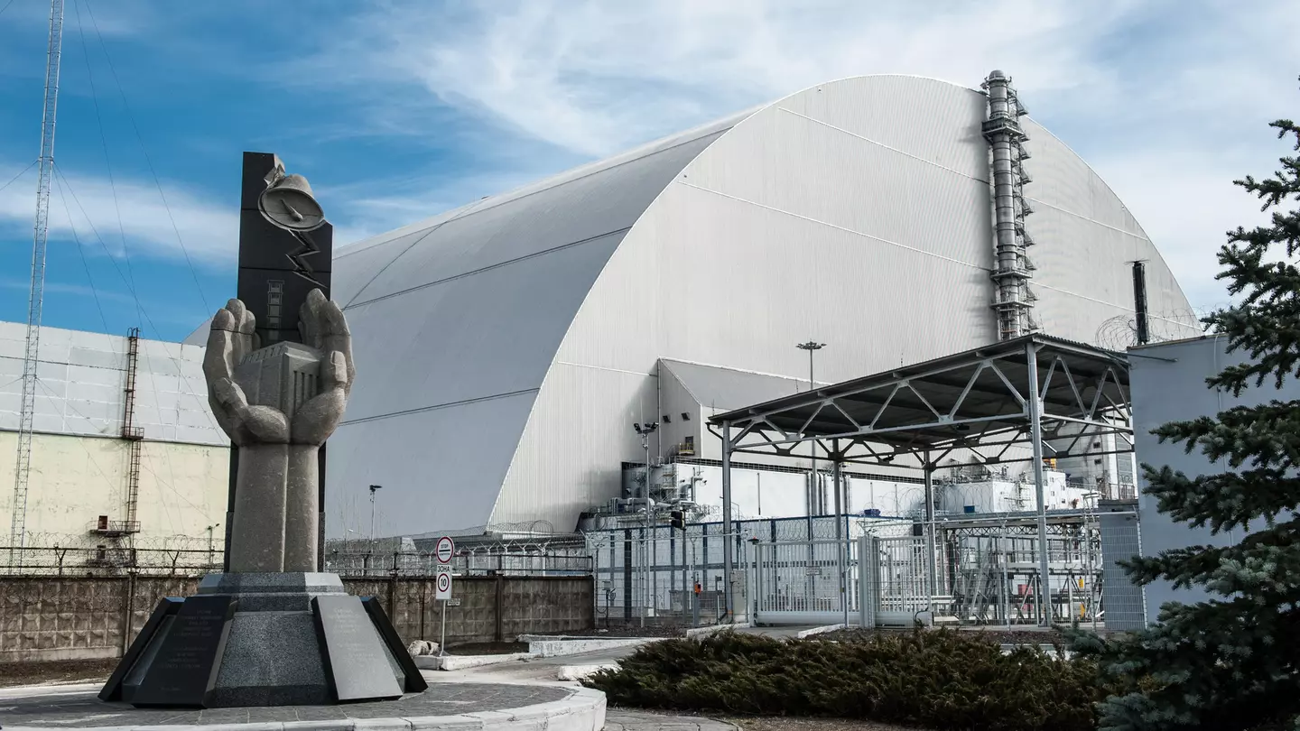 Monument to emergency workers outside Chernobyl, with concrete sculptures of firefighters with hoses tackling the explosion.