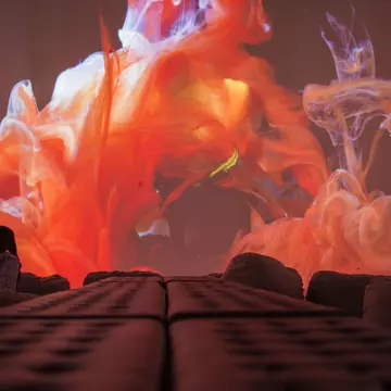 A visitor watches the Kingdom of Colors exhibition, an immersive visual experience from French filmmaker Thomas Blanchard and artist Oilhack, at the ARTECHOUSE gallery in Washington, DC on November 8, 2017..It all began as an accident. After hurti...