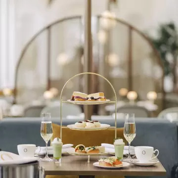 The food offer for afternoon tea at Kensington Palace including a cake stand with cakes and finger sandwiches