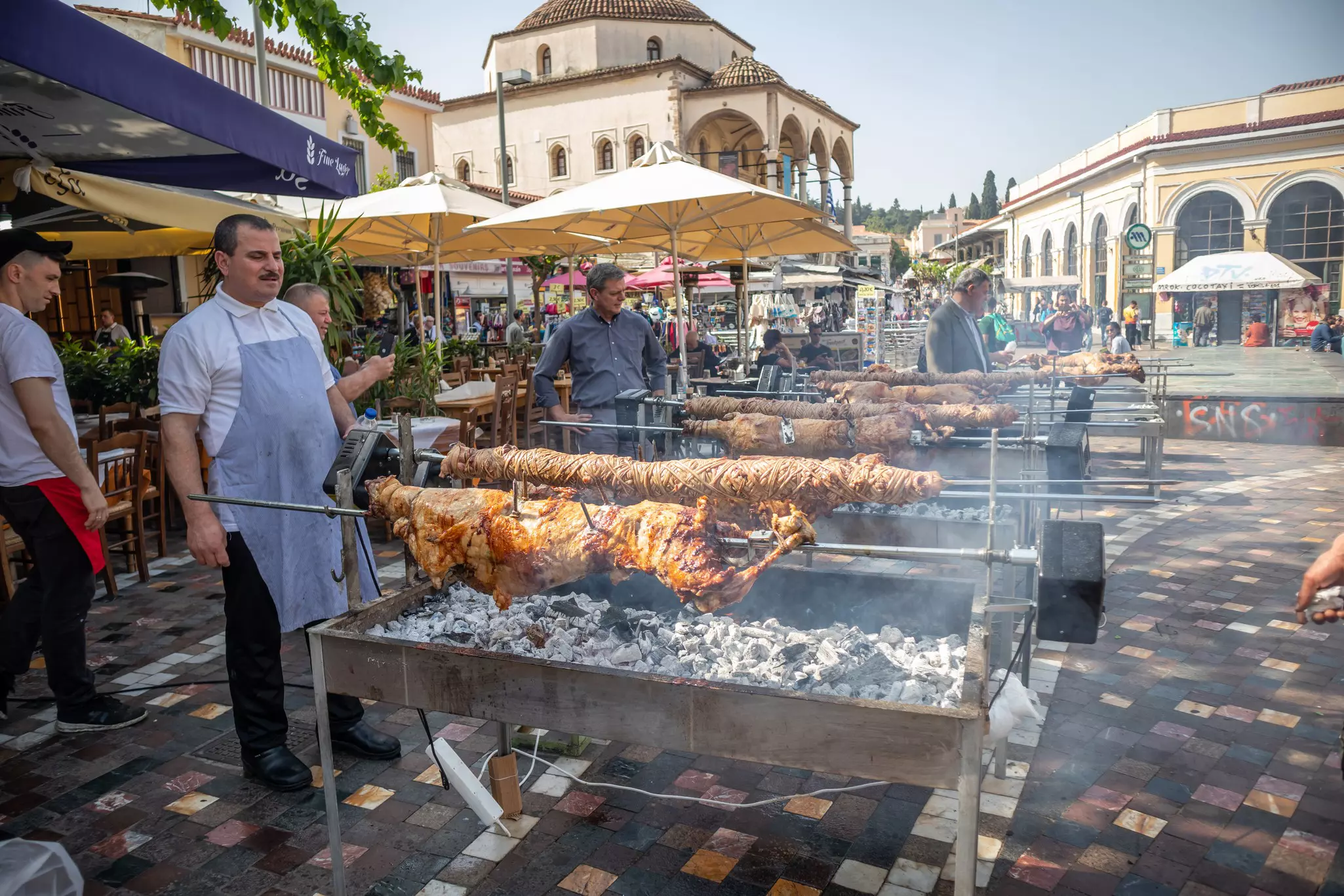 Kokorec and lamb are grilling on skewers over charcoal fire. Greek Easter custom, Monastiraki
