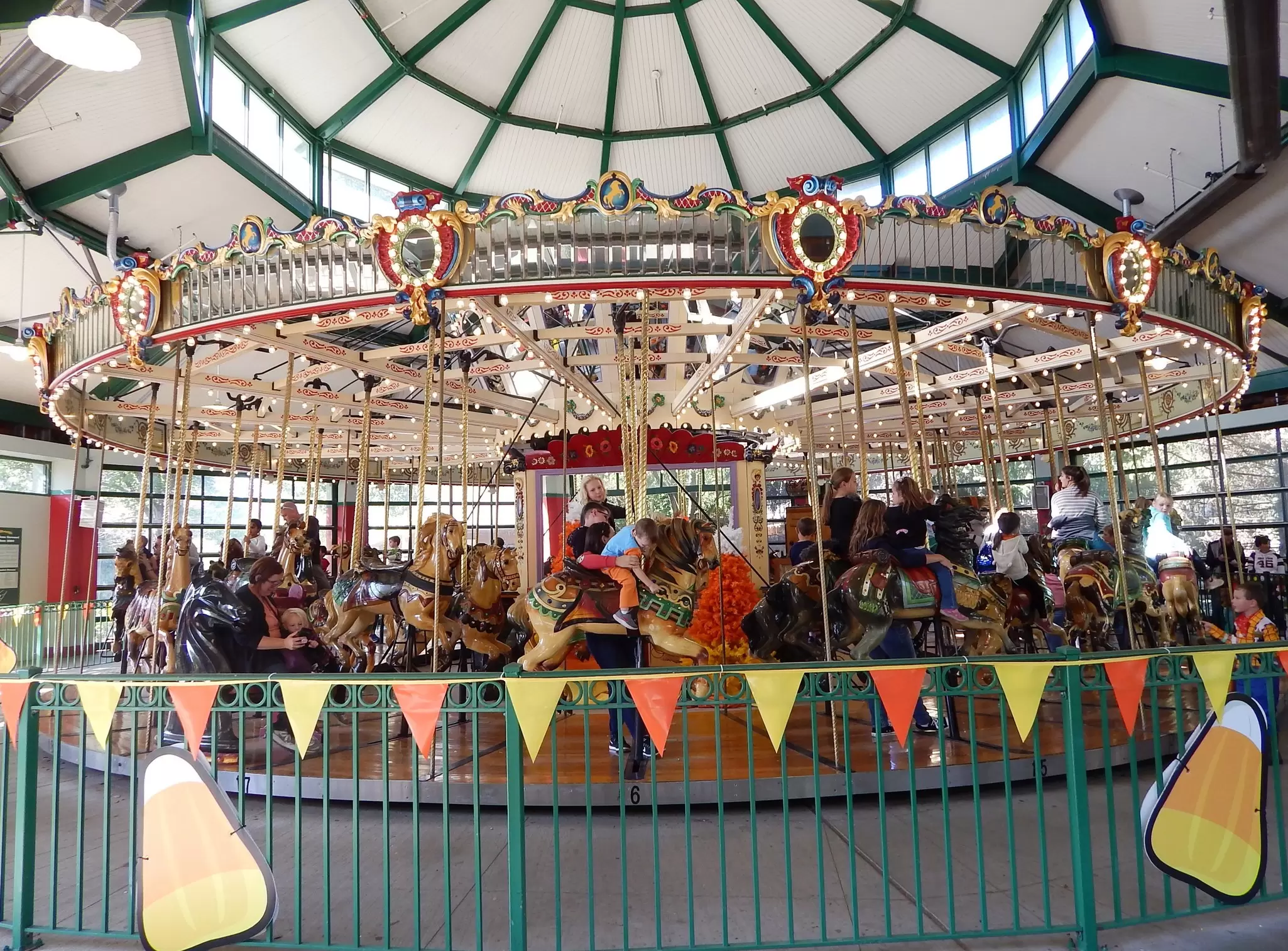 Kids ride an old-fashioned carousel at Columbus Zoo in Ohio