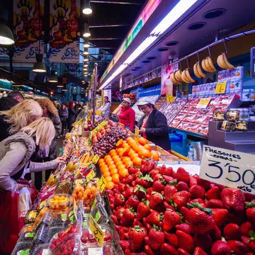Locals shop in Mercat de Santa Caterina market in the La Rambla area of Barcelona, Spain.