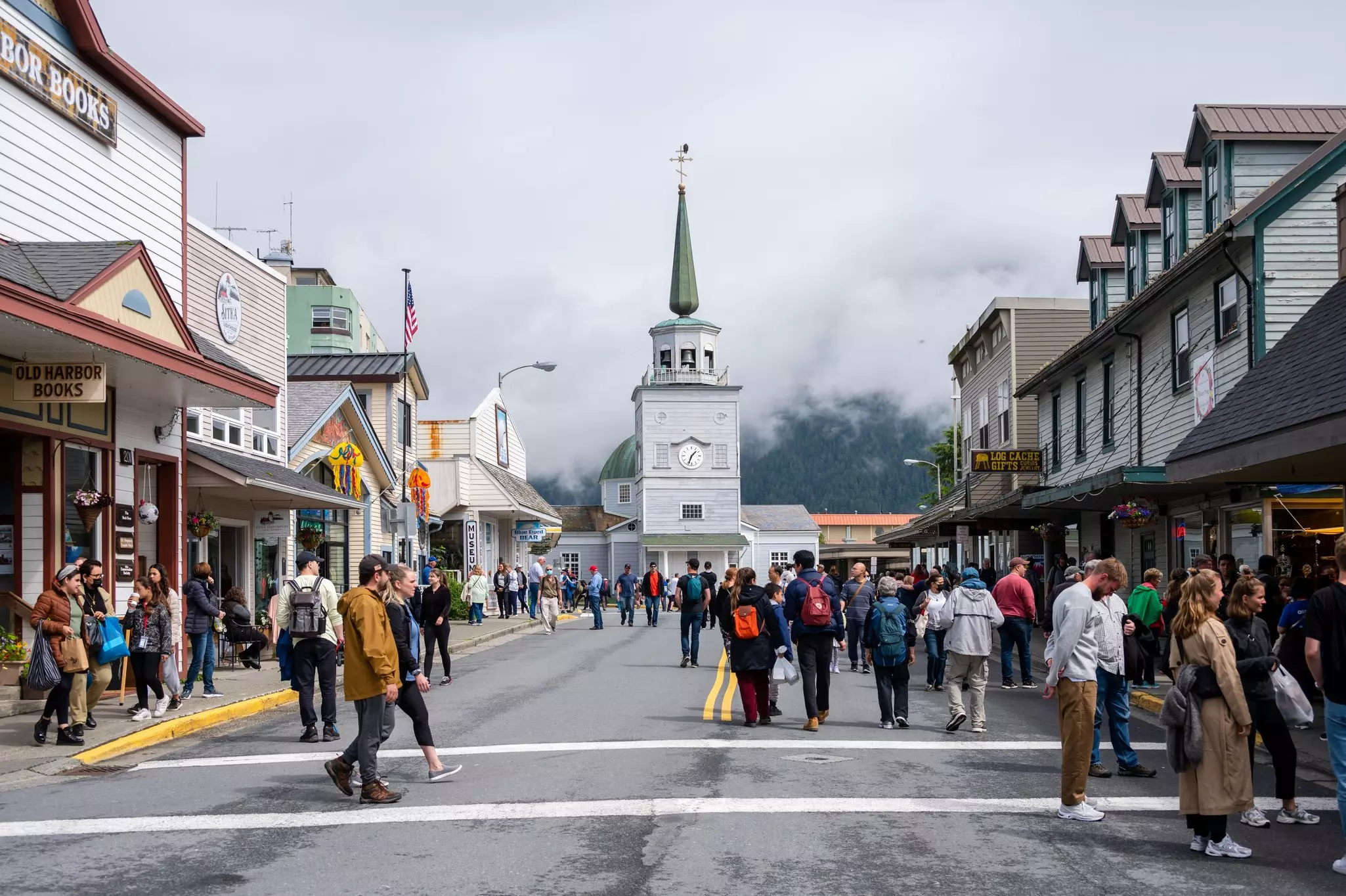 People walking along Sitka's historic main street. St. Michaels Othodox church visible.