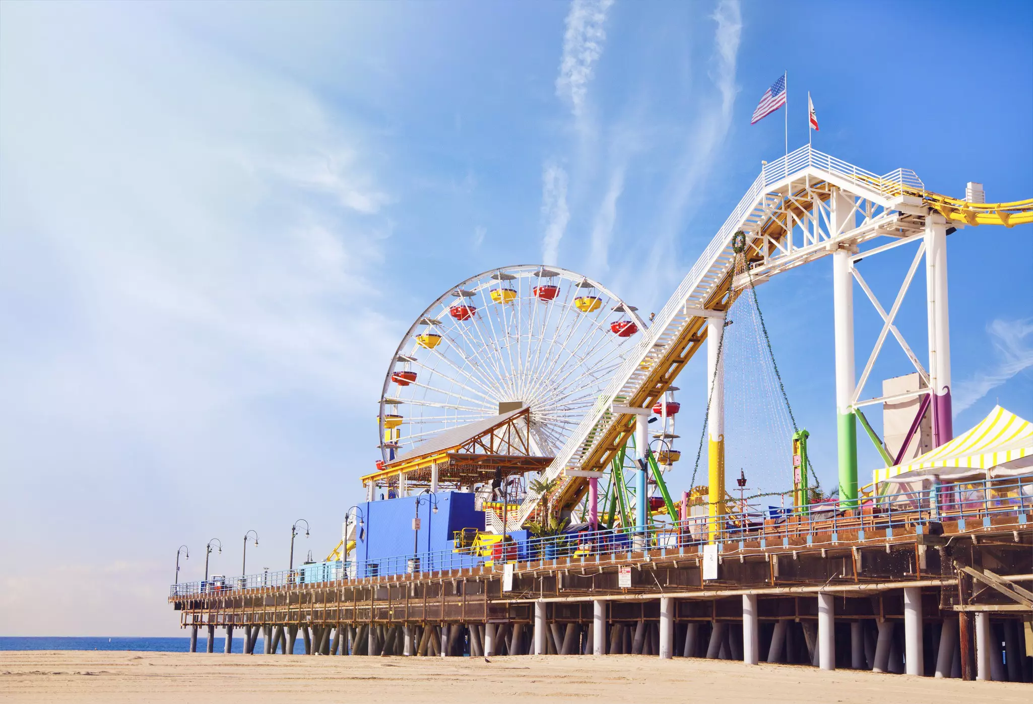 a view of Santa Monica beach and pier from the beach