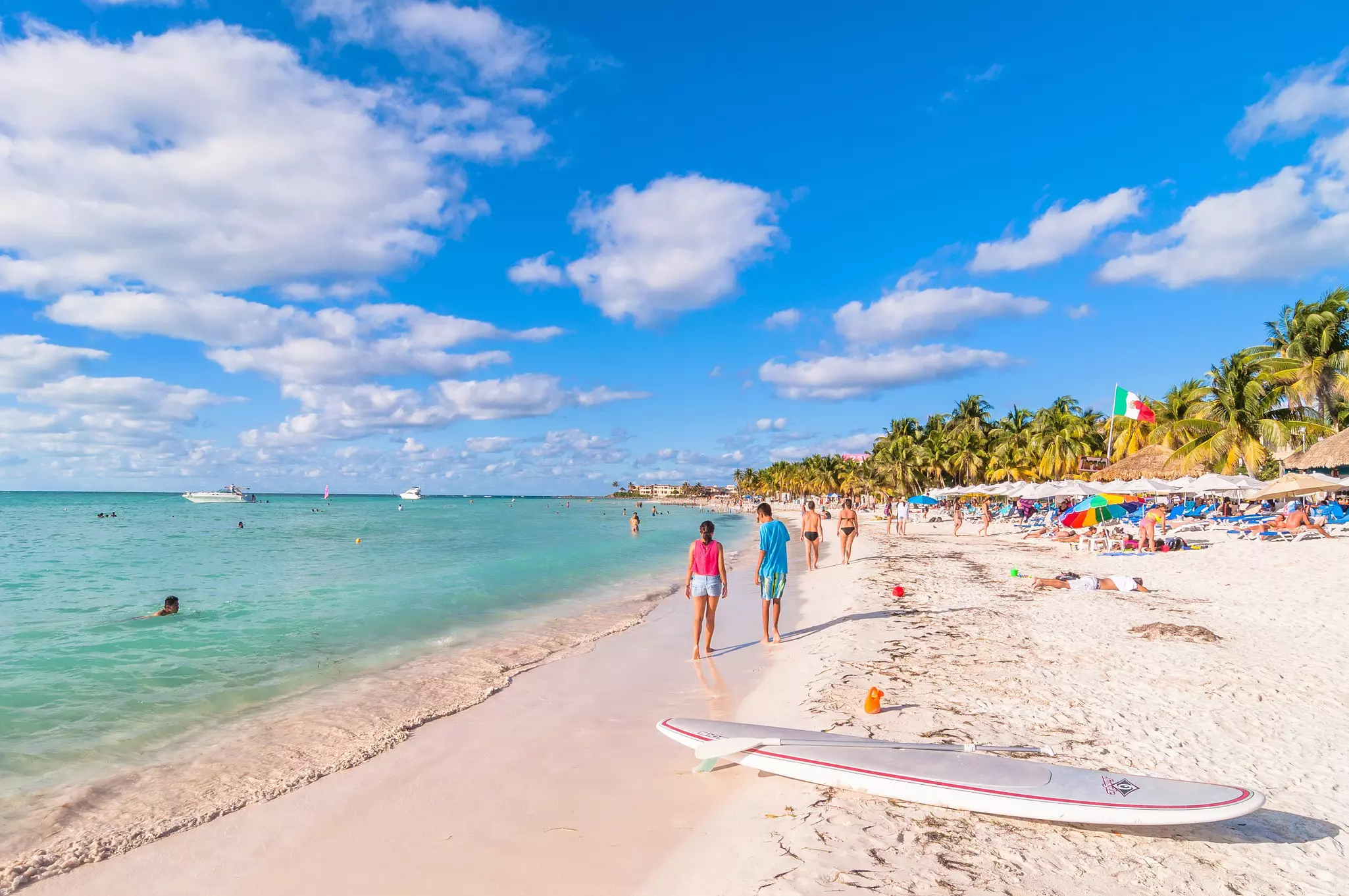 Visitors on the sands of Playa del Norte beach in Isla Mujeres.