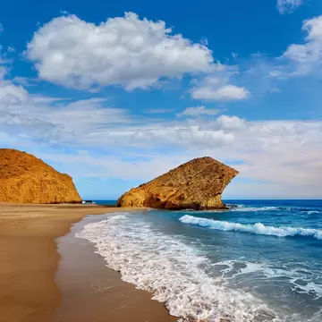 Waves crashing onto the shore at Playa de Mónsul in the Parque Natural de Cabo de Gata-Níjar, Spain.
