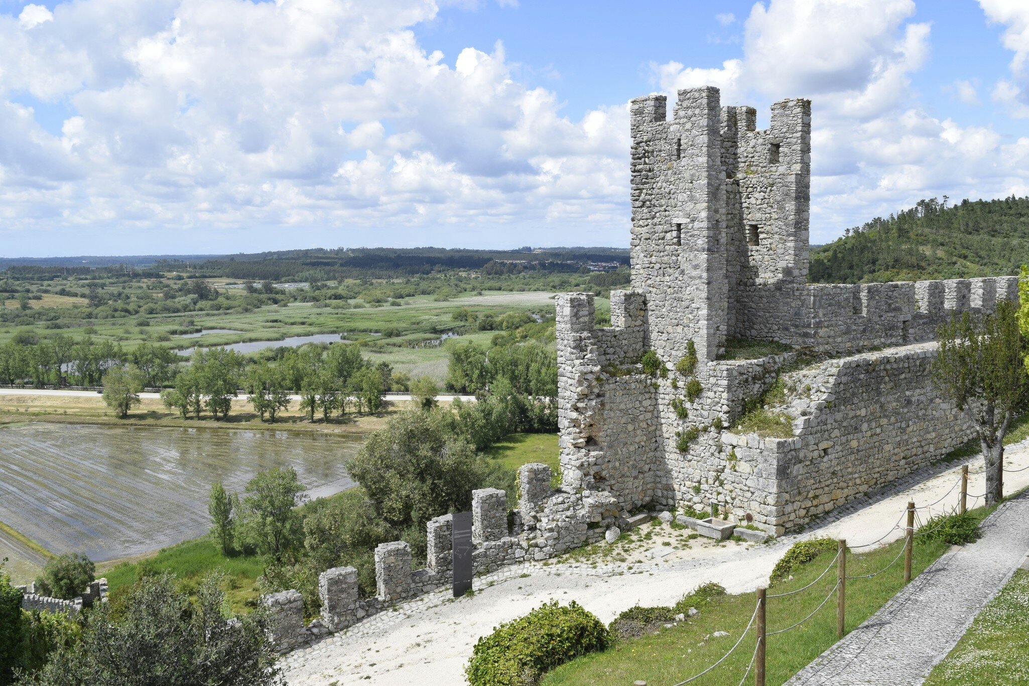 View of the ruins of the Castle of Montemor-o-Velho in Portugal, with views of the surrounding rice-paddies.