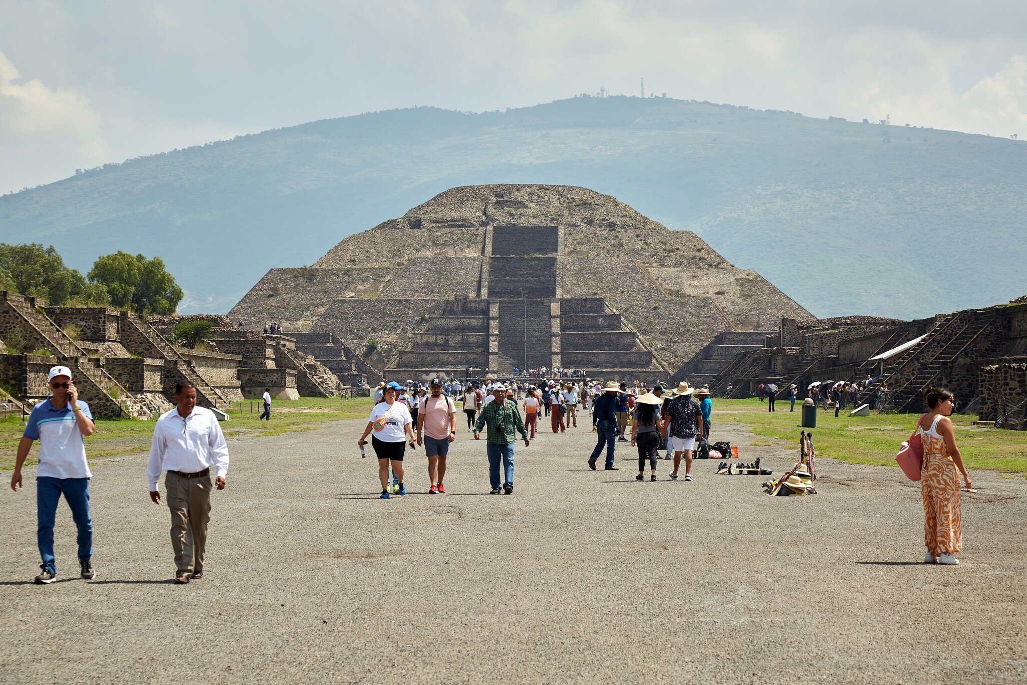 Moon pyramid with people (tourists) walking, Teotihuacan, Mexico.