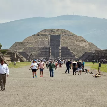 Moon pyramid with people (tourists) walking, Teotihuacan, Mexico.