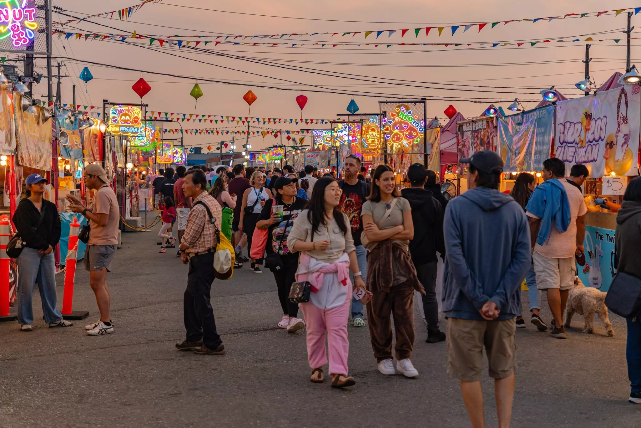 People walking around the local Asian night market in Richmond, Vancouver, BC, Canada