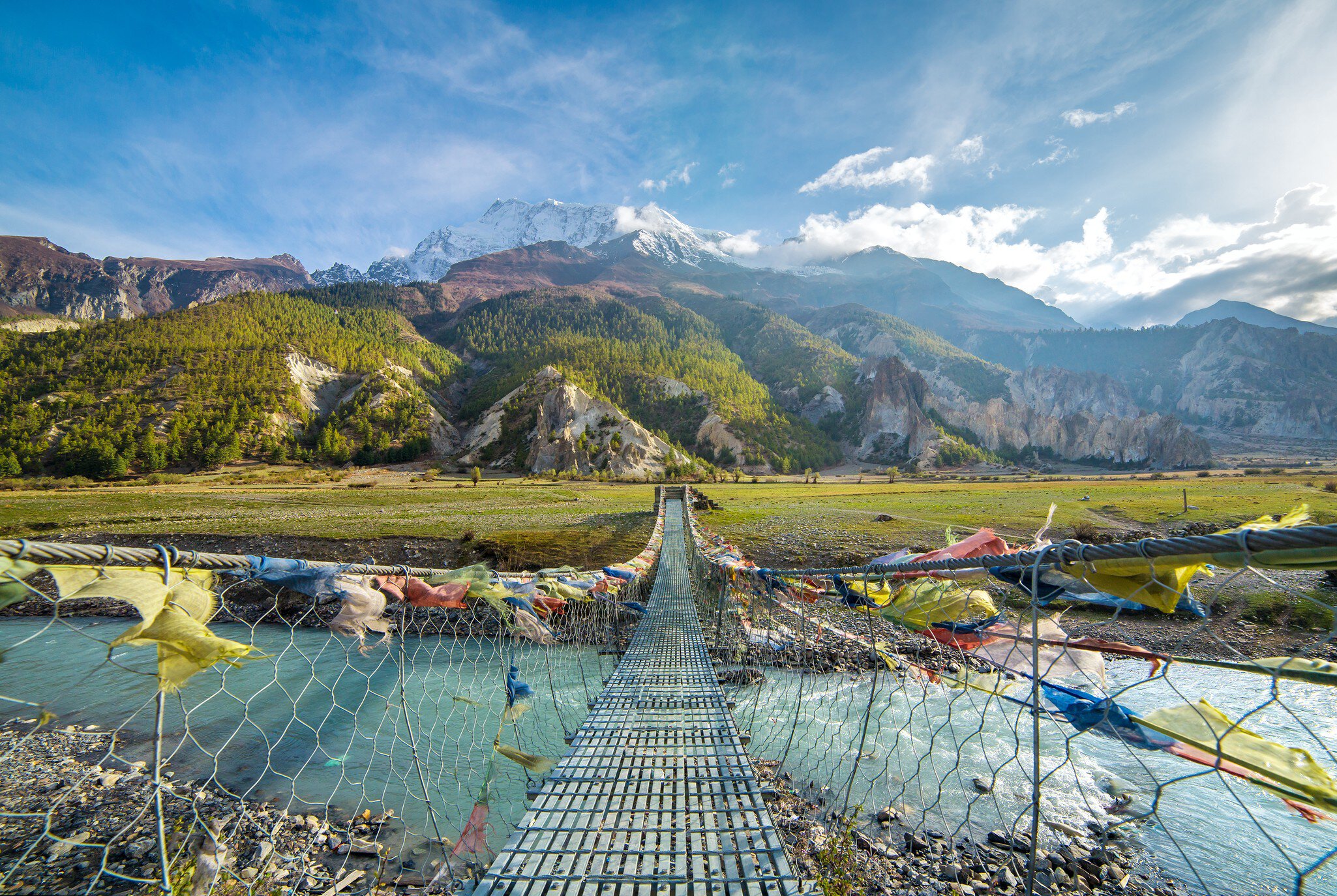 Suspension bridge with buddhist prayer flags on the Annapurna circuit trek in Nepal. Shangri-la land
514805992
