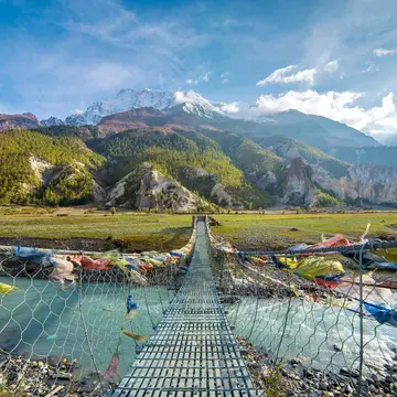 Suspension bridge with buddhist prayer flags on the Annapurna circuit trek in Nepal. Shangri-la land
514805992