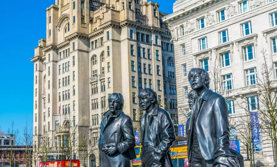 Statue of the Beatles in front of the royal liver building in Liverpool, England.