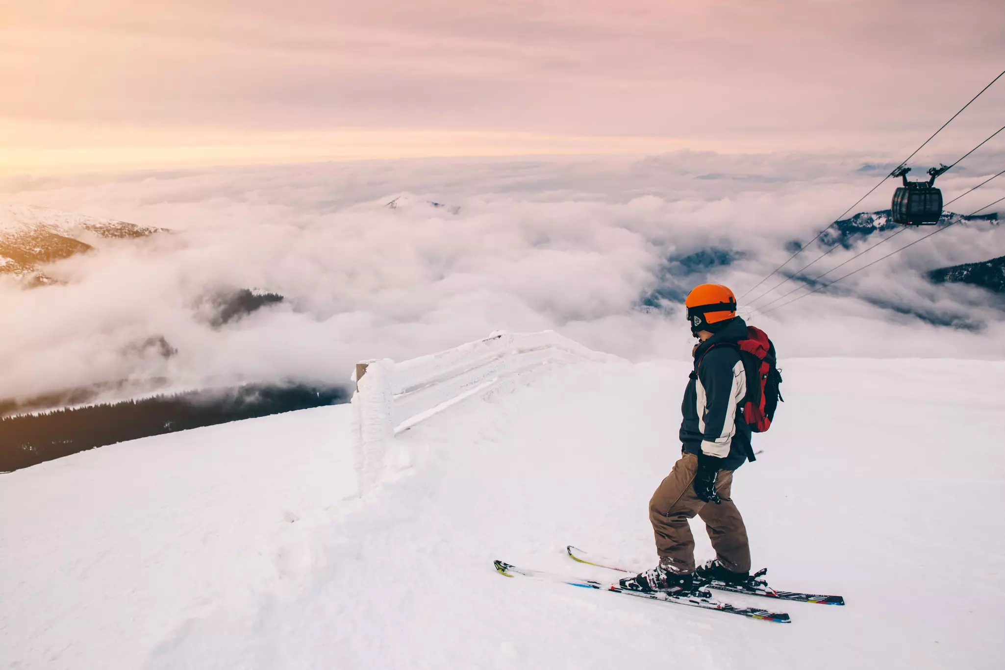 A skier in the mountains above the clouds in Slovakia.
