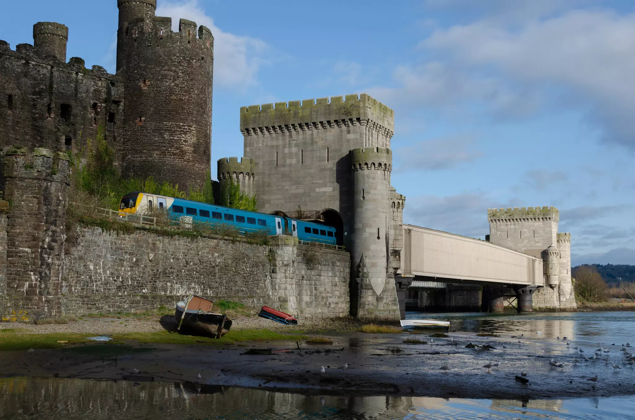 A train passes Conwy Castle, Wales, United Kingdom