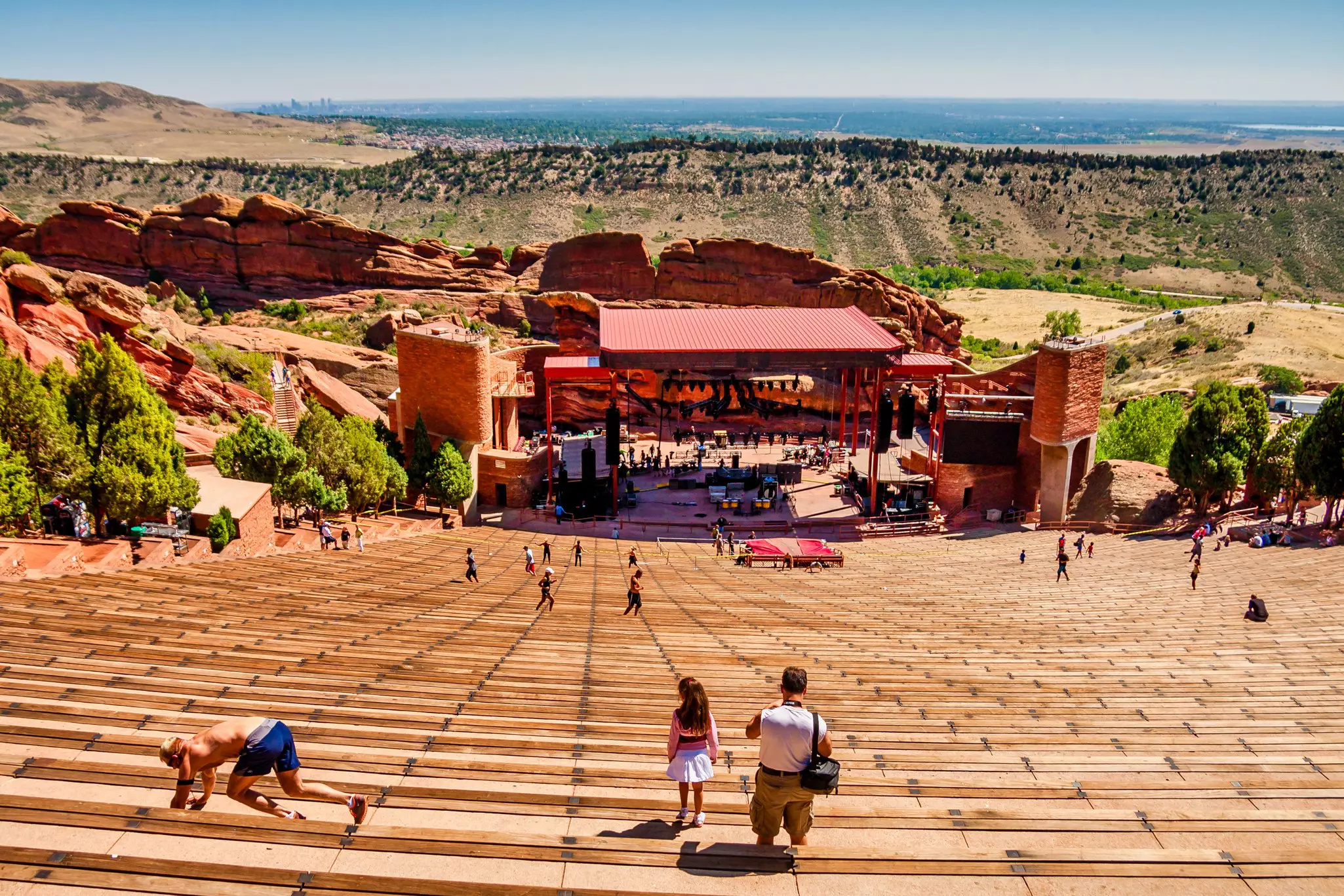 Red Rocks Amphitheatre is an open-air theater built into rock ten miles west of Denver, which opened in 1941.