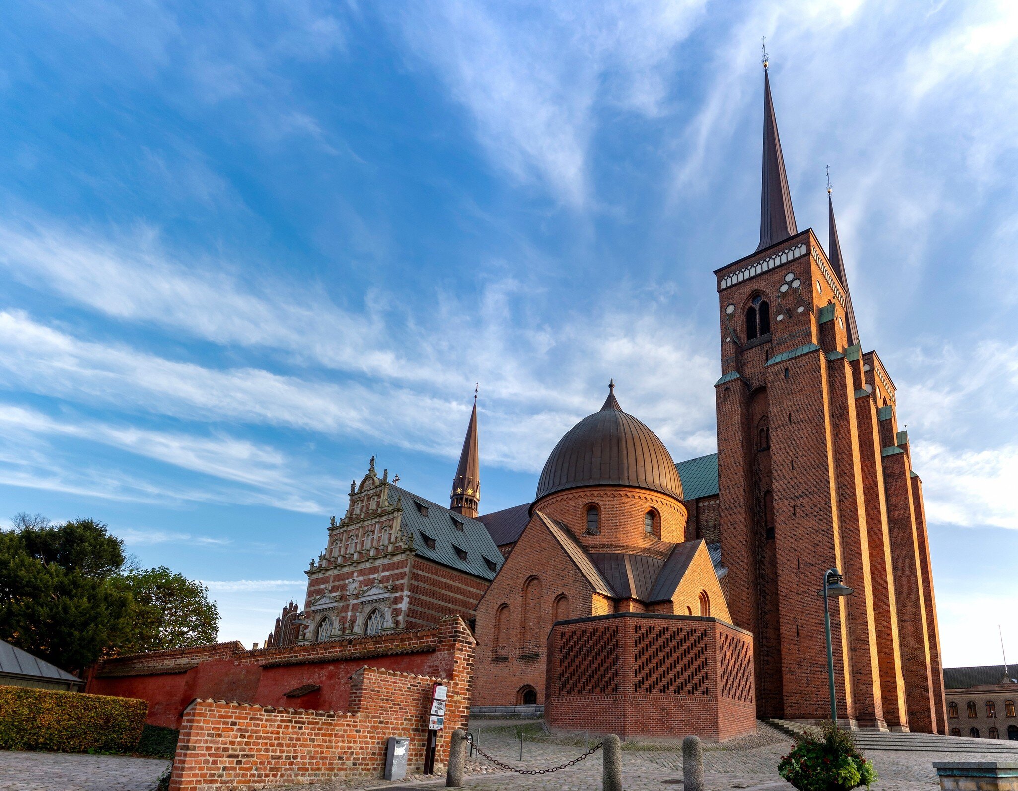 Wide angle image of Roskilde Cathedral in Denmark at sunset.