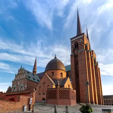 Wide angle image of Roskilde Cathedral in Denmark at sunset.