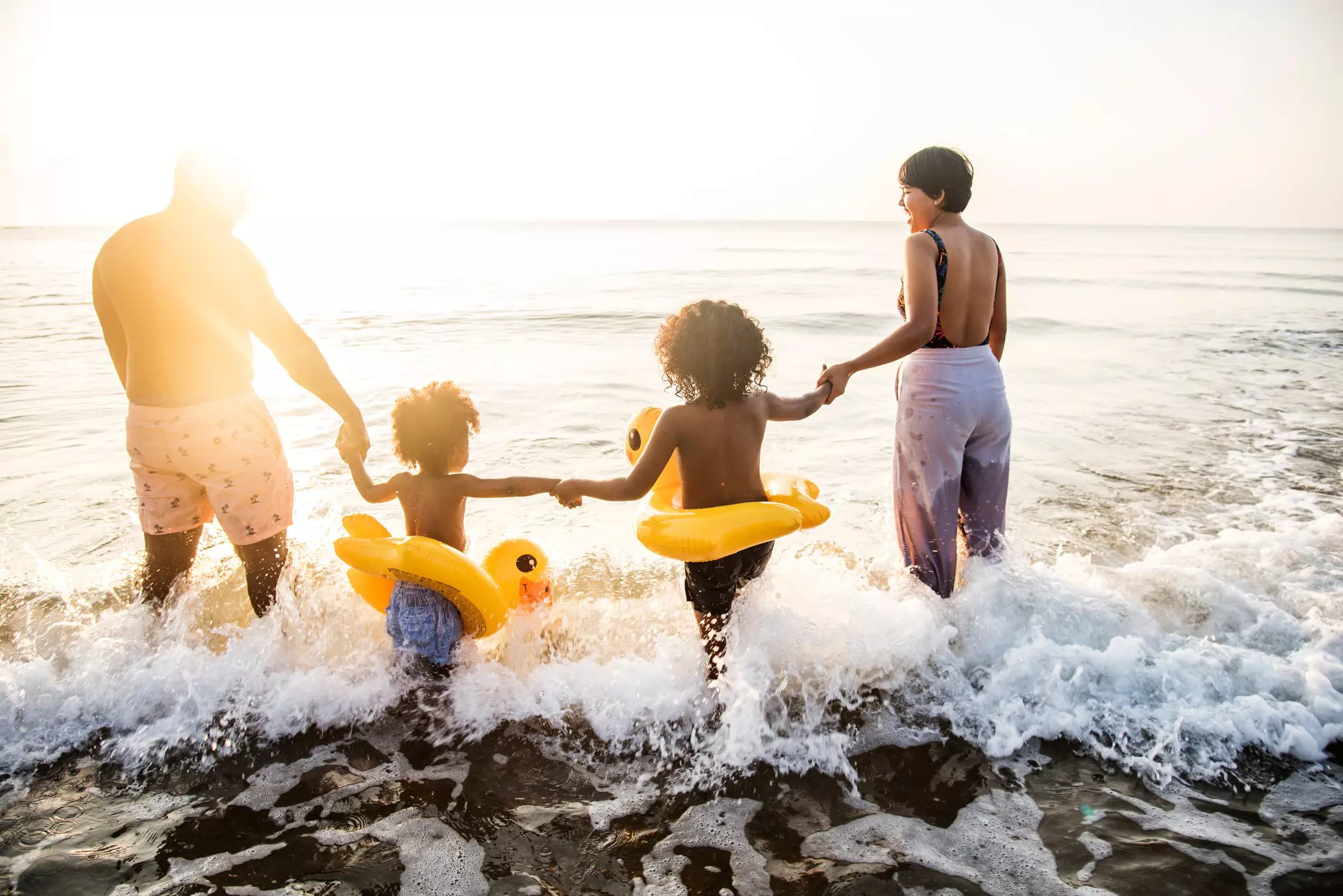 Two kids walking to the beach